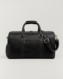 Front view of the Laylowe Blake black leather duffle with twin handles, zip pocket and adjustable shoulder strap.