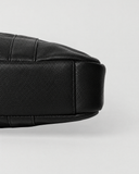 Base detail of the Laylowe Nolan black leather laptop case showing its slim profile and stitched leather panels.