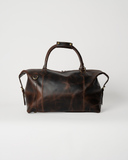 Rear view of the Laylowe Hayes dark brown leather weekender with two carry handles and stitched leather panels.