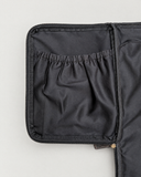 Close-up of a gathered interior pocket and zipper on the Laylowe Ellis charcoal leather garment duffle.
