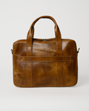 Rear view of the Laylowe Nolan light brown leather laptop case showing its luggage strap and two carry handles.